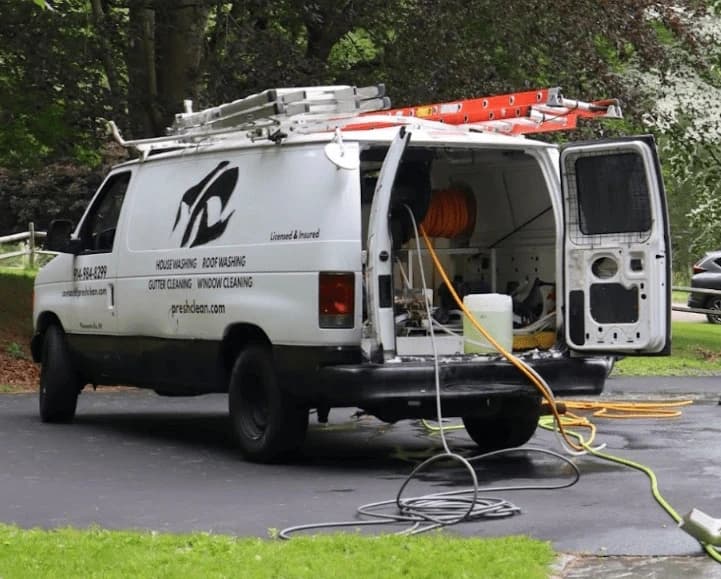 New Franklin Power Washing professionals cleaning commercial fleet in New Franklin